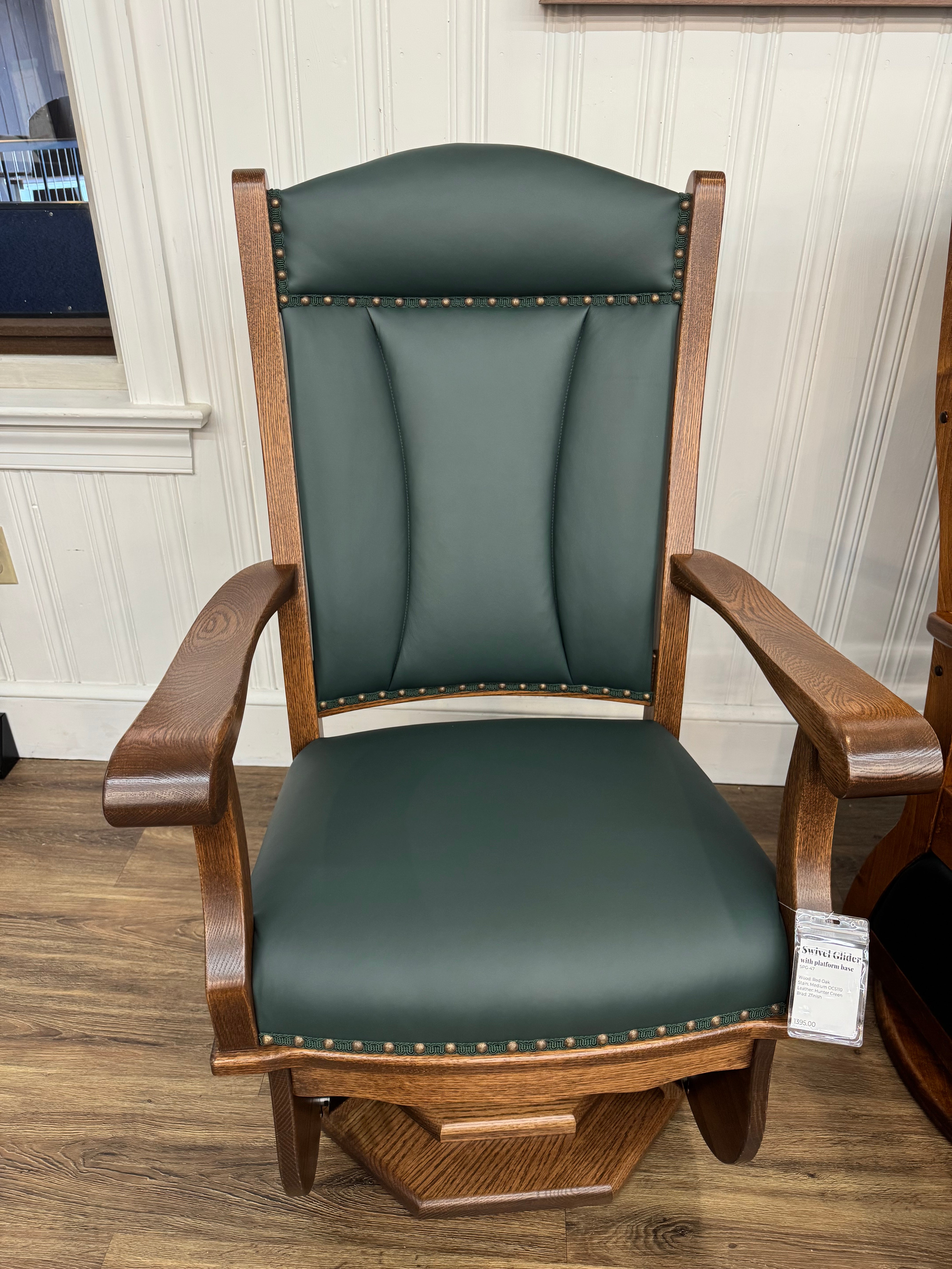 Front view of Amish made swivel glider rocker chair in solid oak with hunter green upholstered cushions – handcrafted furniture