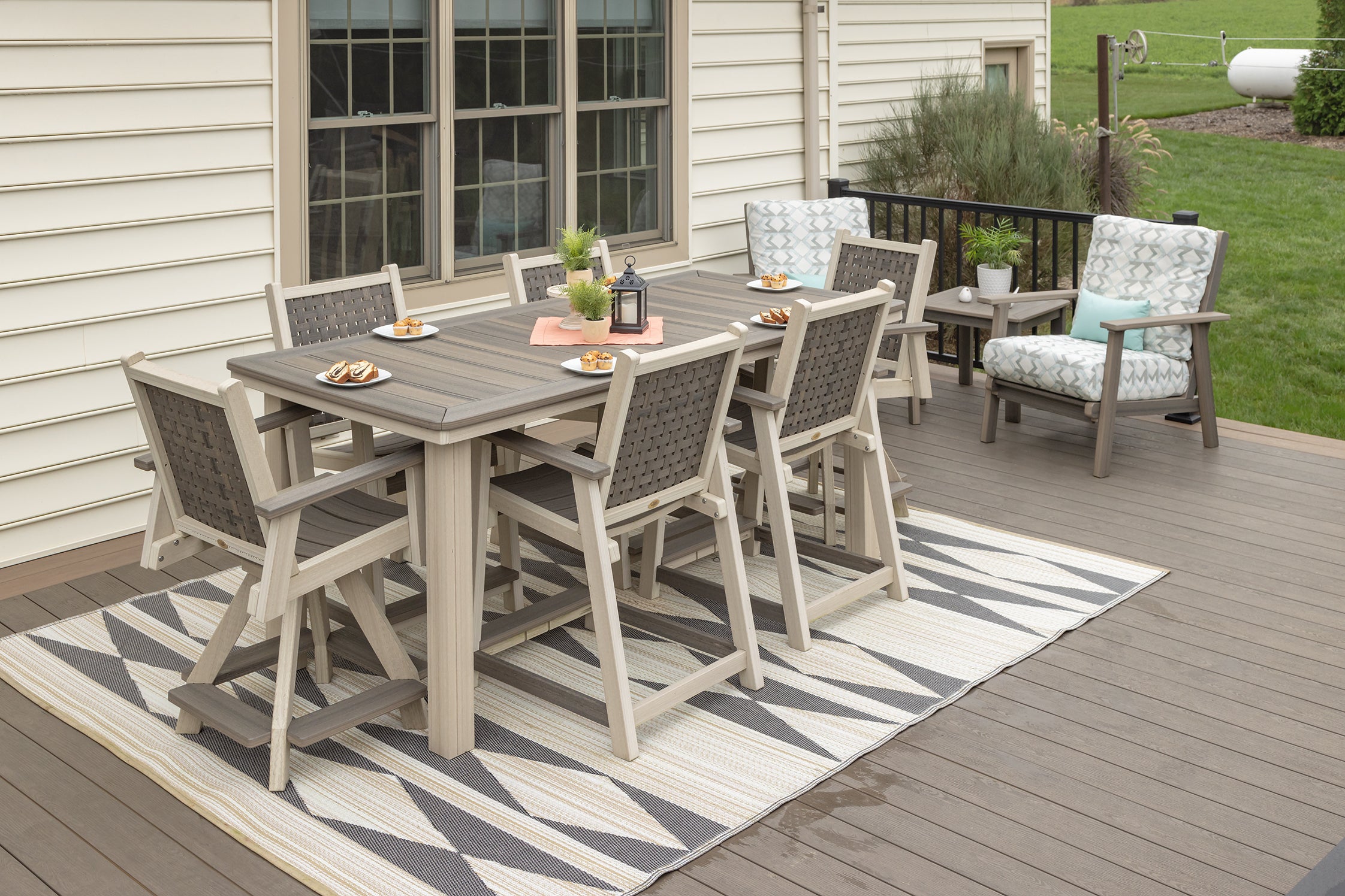Marina outdoor dining table with four matching arm chairs, and two swivel chairs - quality patio furniture