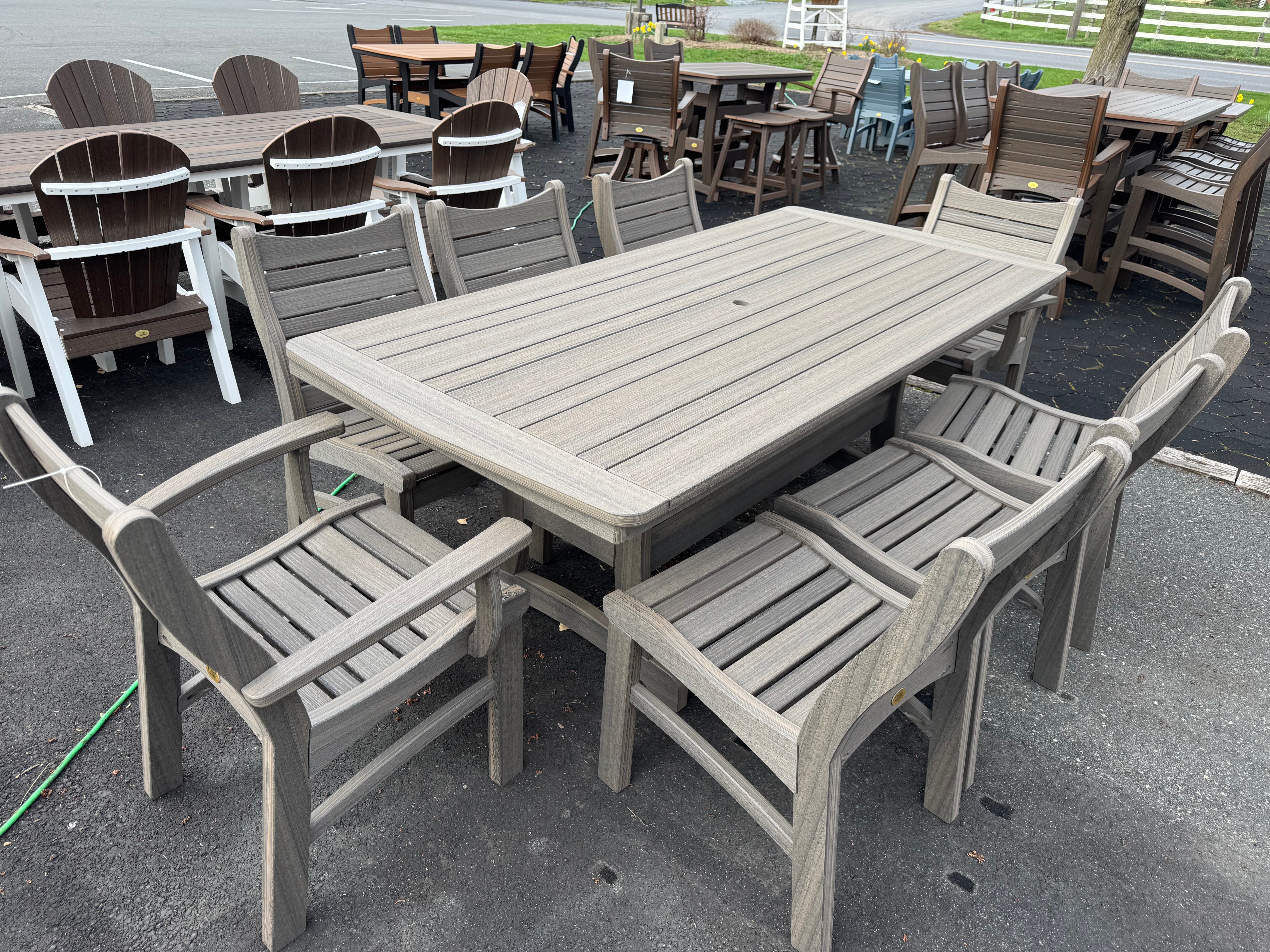 Amish made Bayshore patio dining table with four matching chairs and two swivel chairs in coastal gray color- quality outdoor poly furniture near Lancaster, Pennsylvania