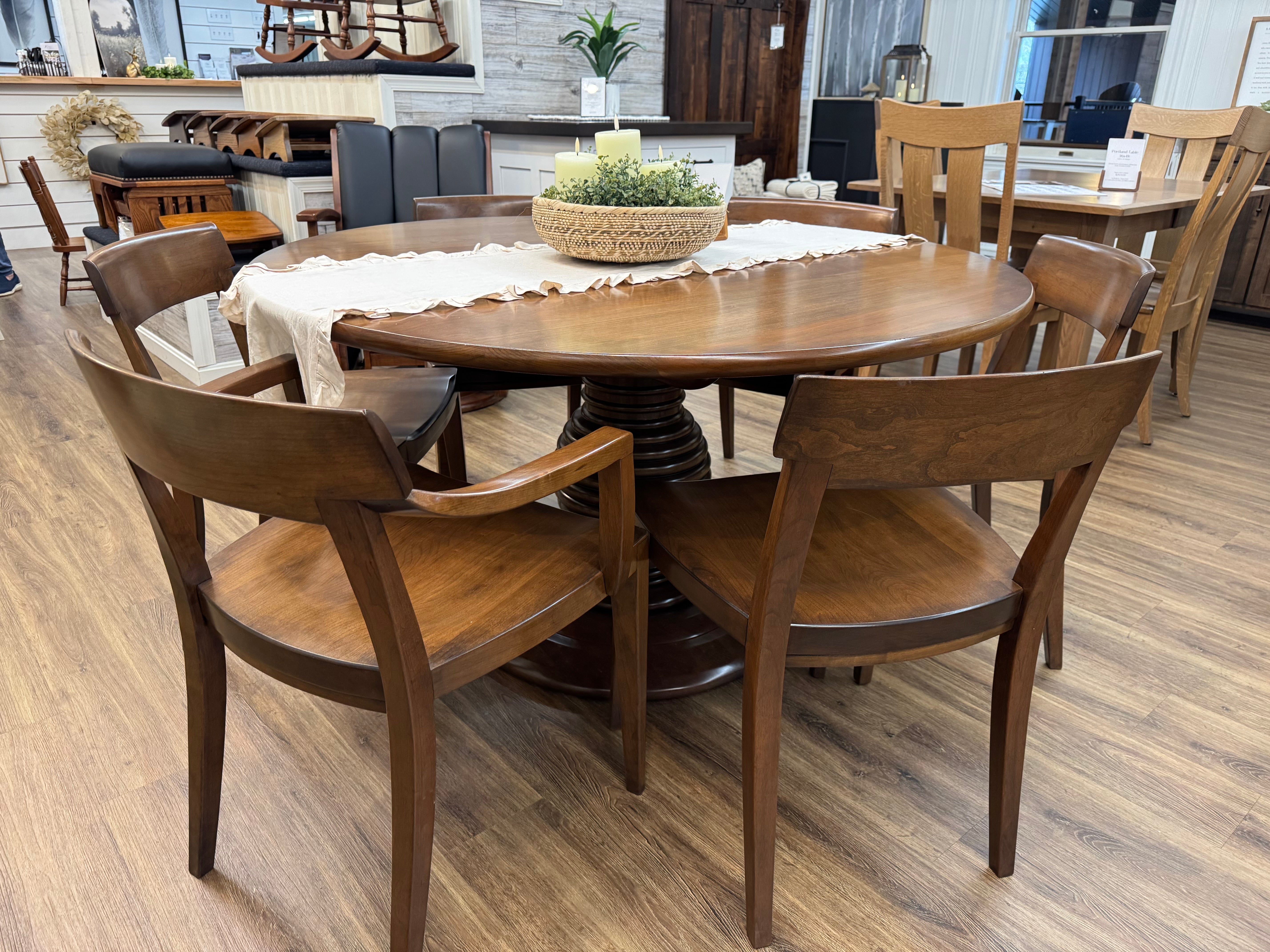 Amish made round 54 inch pedestal dining table in solid cherry wood, with  four side chairs, and two arm chairs - handcrafted furniture in Lancaster Pennsylvania