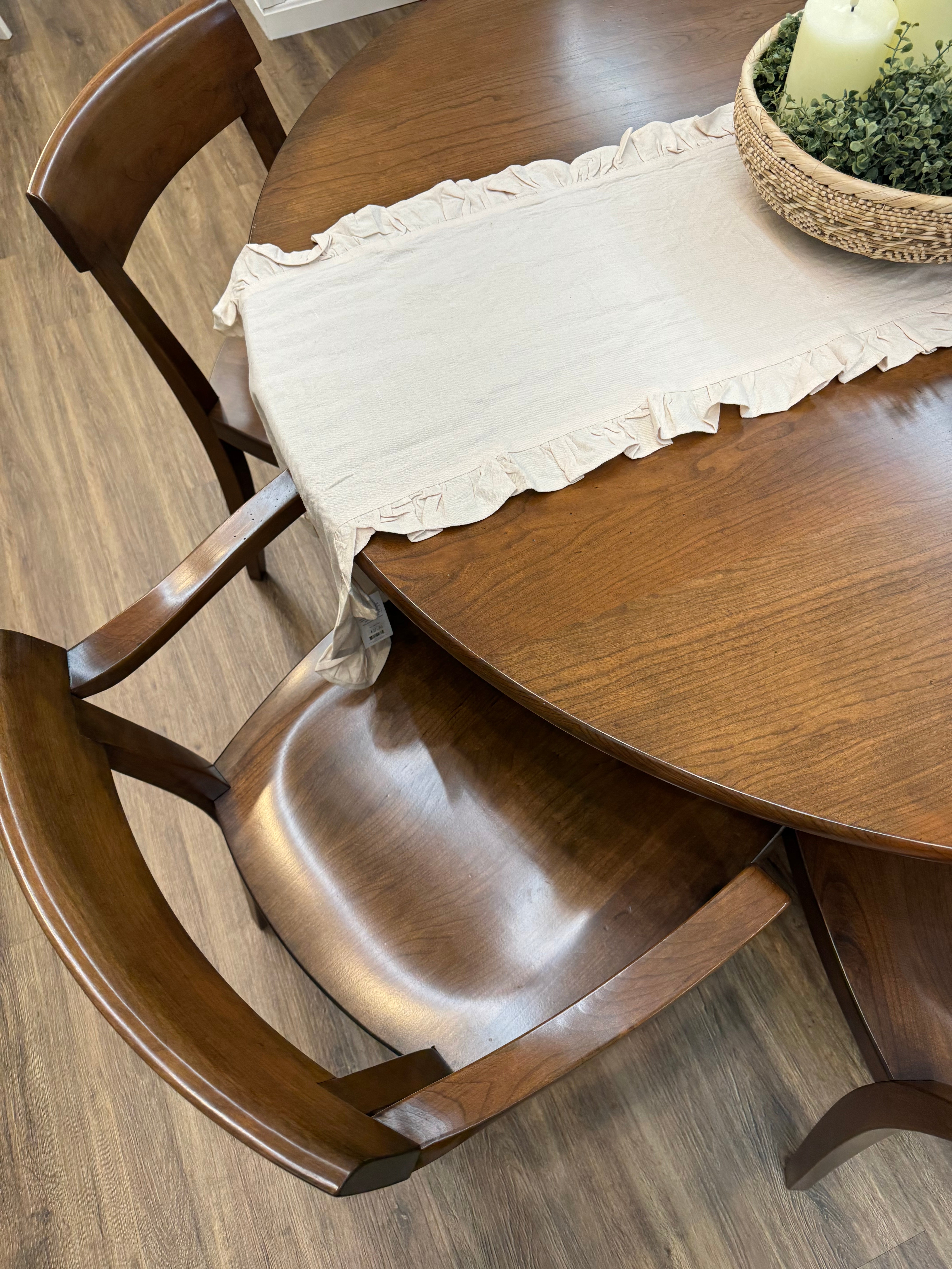 Close-up view of Amish made round 54 inch pedestal dining table in solid cherry wood - handcrafted furniture in Lancaster Pennsylvania